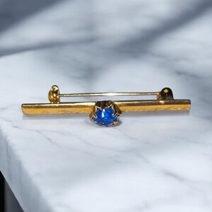 Gold Bar Brooch with Blue Gem